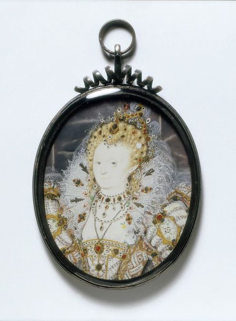 Watercolour. This oval painting shows Elizabeth I with notably pale skin. Her blond hair is piled high on her head and encrusted with jewels under a crown. Her elaborately embroidered bodice and puffed sleeves are also sewn with jewels. She wears several necklaces, and her head is framed by a full, high, lace ruff.